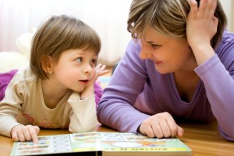 child reading with mom